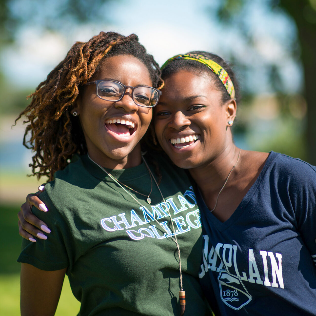 smiling students exchange hug